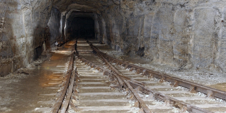 The rail lines heading deeper underground.