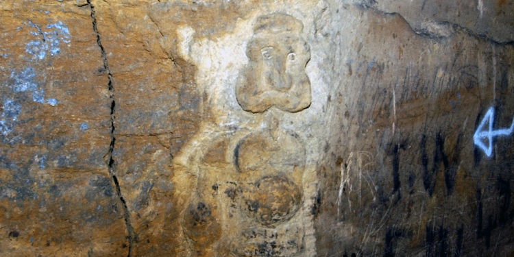 A quarryman's carving in the rock under Box.