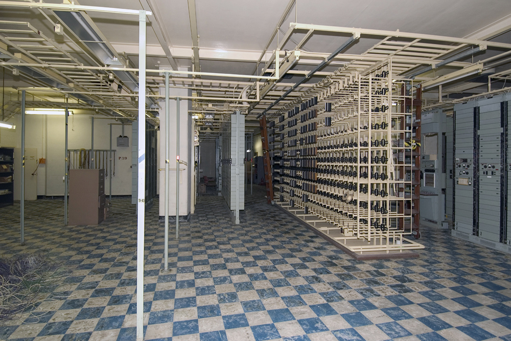 The strowger room, an electro-mechanical switching system which replaced the old 50s switchboard.