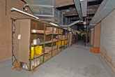 Racking and supplies in the storage area, containing everything from glass ashtrays to stationary.