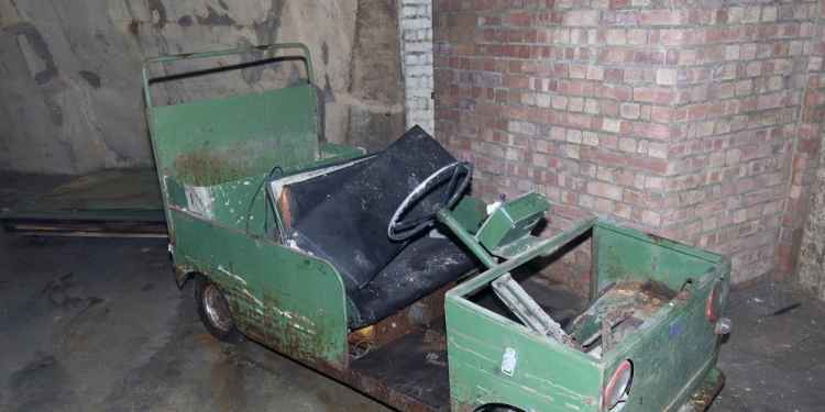 An old electric cart abandoned underground.