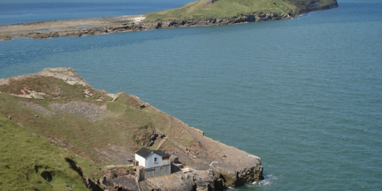 The boathouse with Worms Head head in the background.