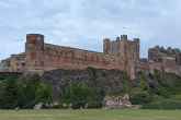 Bamburgh Castle perched on a hill on the Northumberland coast