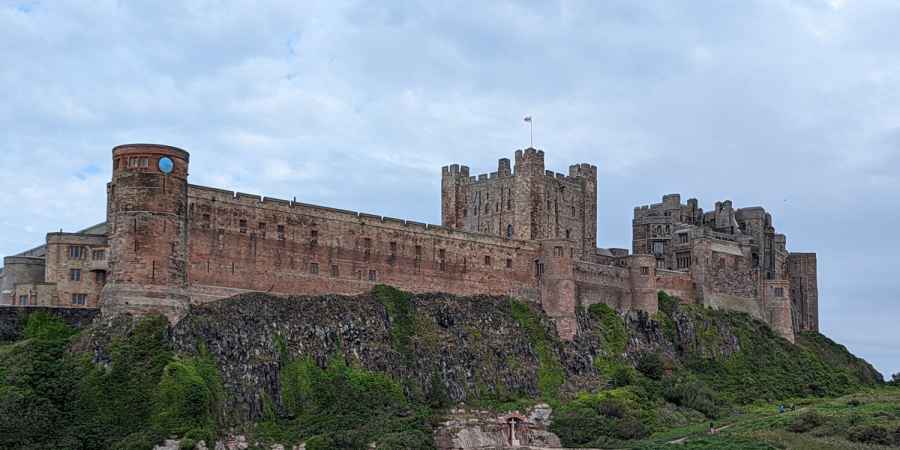 Bamburgh Castle perched on a hill on the Northumberland coast